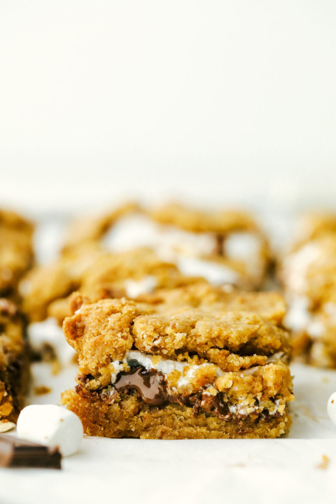 Close up on a square of ooey gooey smores bars.