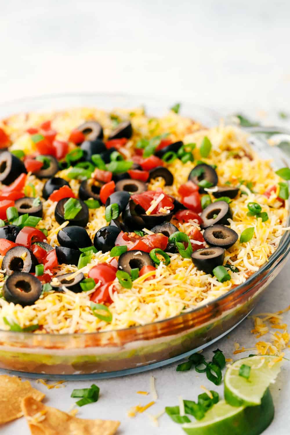 Angle shot of 7 layer dip in a serving dish. 