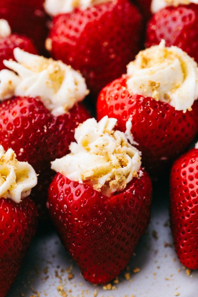 Close up on cheesecake stuffed strawberries.