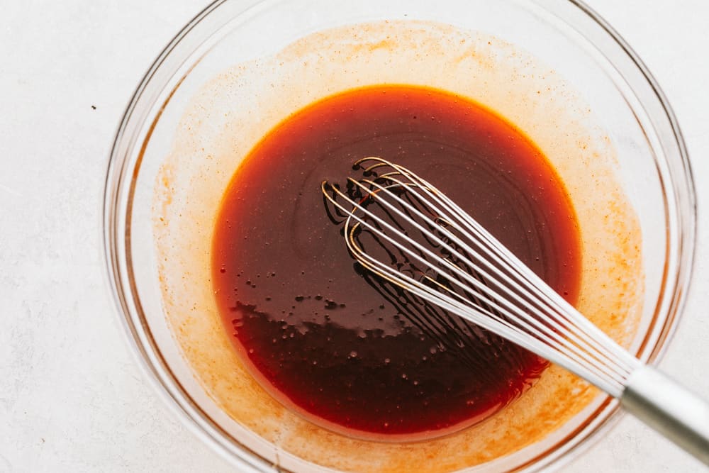 Whisking chicken marinade.