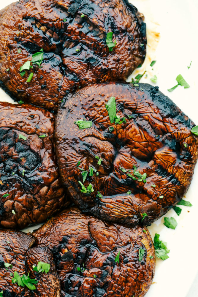 Finished portobello mushrooms with grill marks.