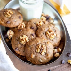 Banana cookies on a serving tray with milk