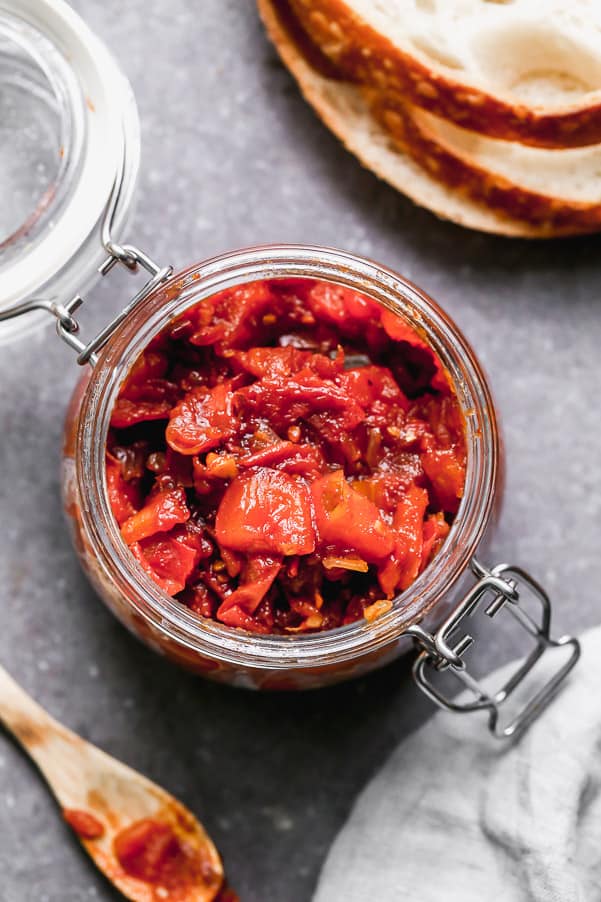 Overhead shot of tomato jam in a jar. 