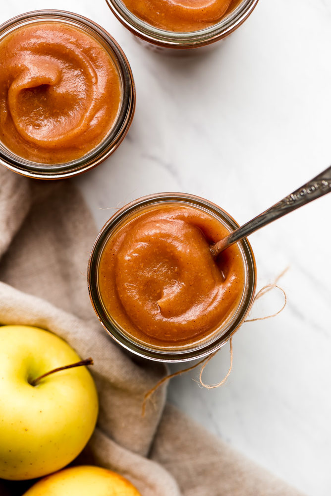 Top view of jars of thick apple butter.