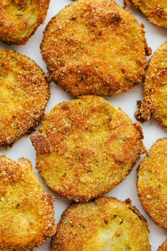 View of finished fried green tomatoes on a tray.