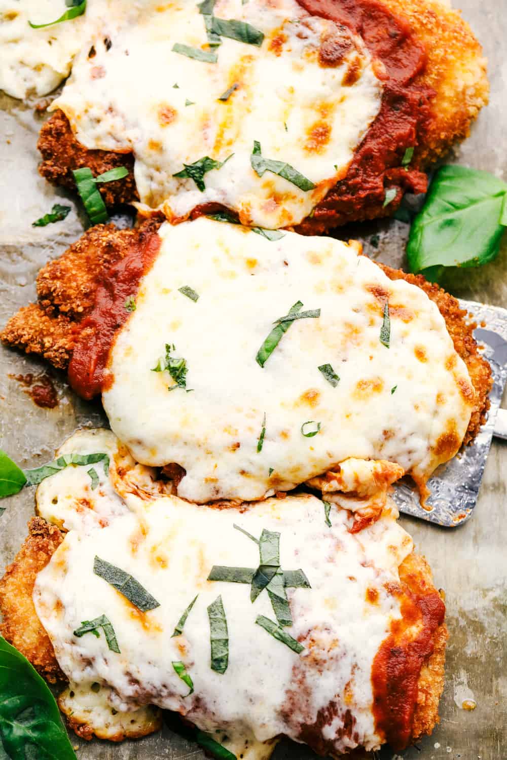 Chicken parmesan with marinara and melted cheese. 