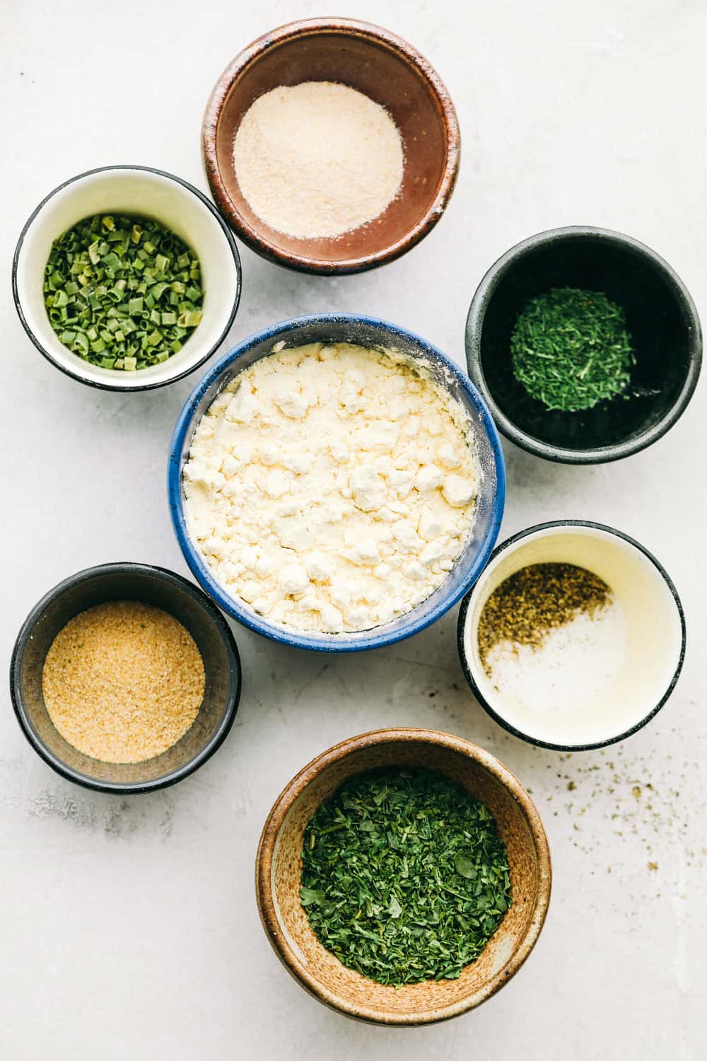 Making Homemade Ranch Seasoning with the seasonings in different bowls.