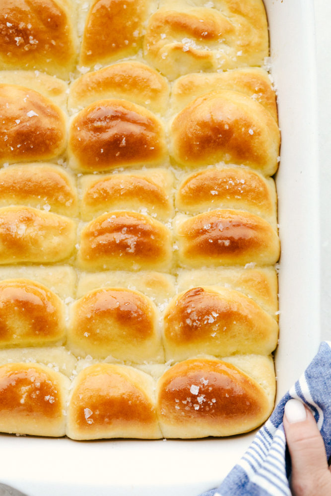 Baked parker house rolls in a pan. 