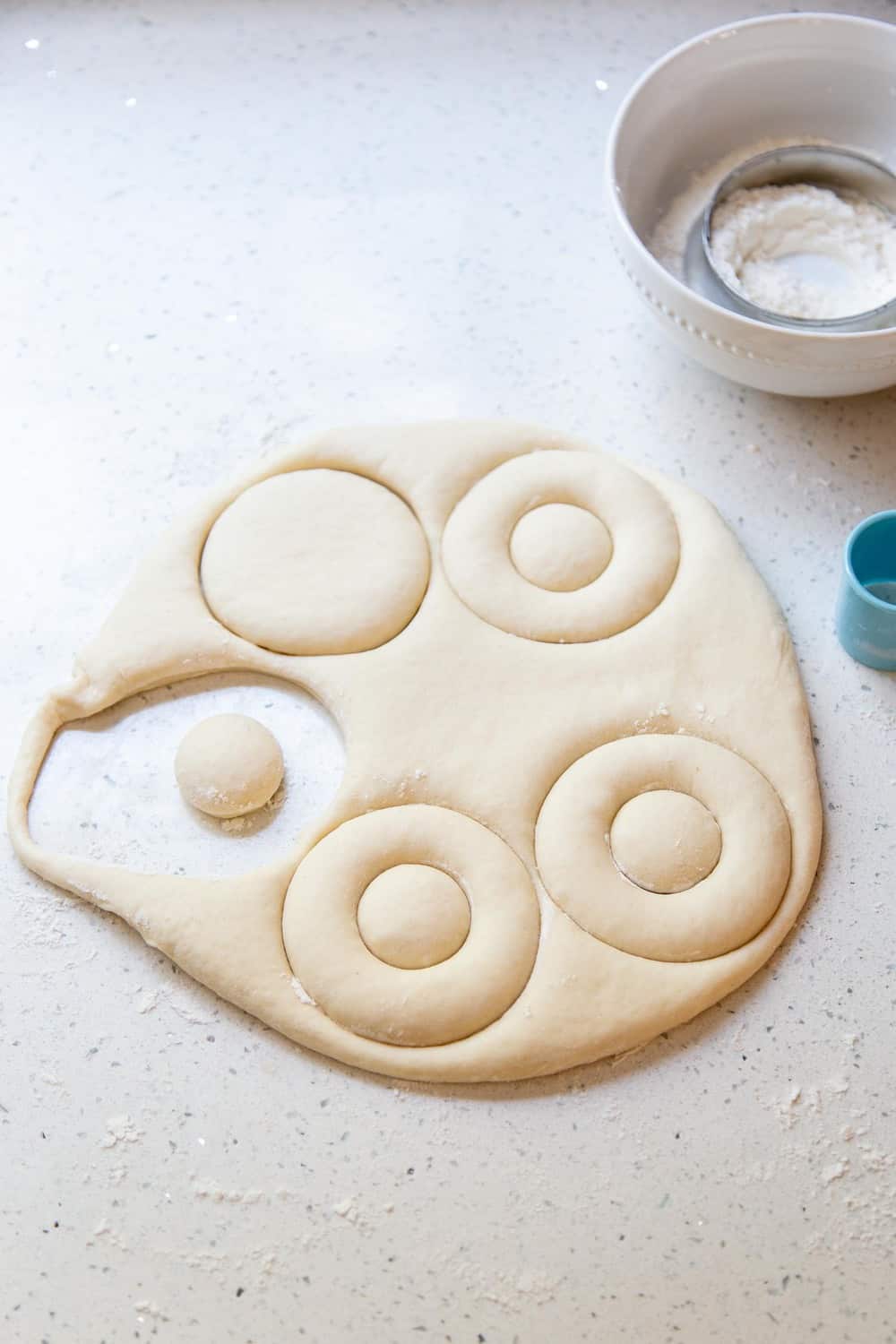 Cutting out the dough for donuts