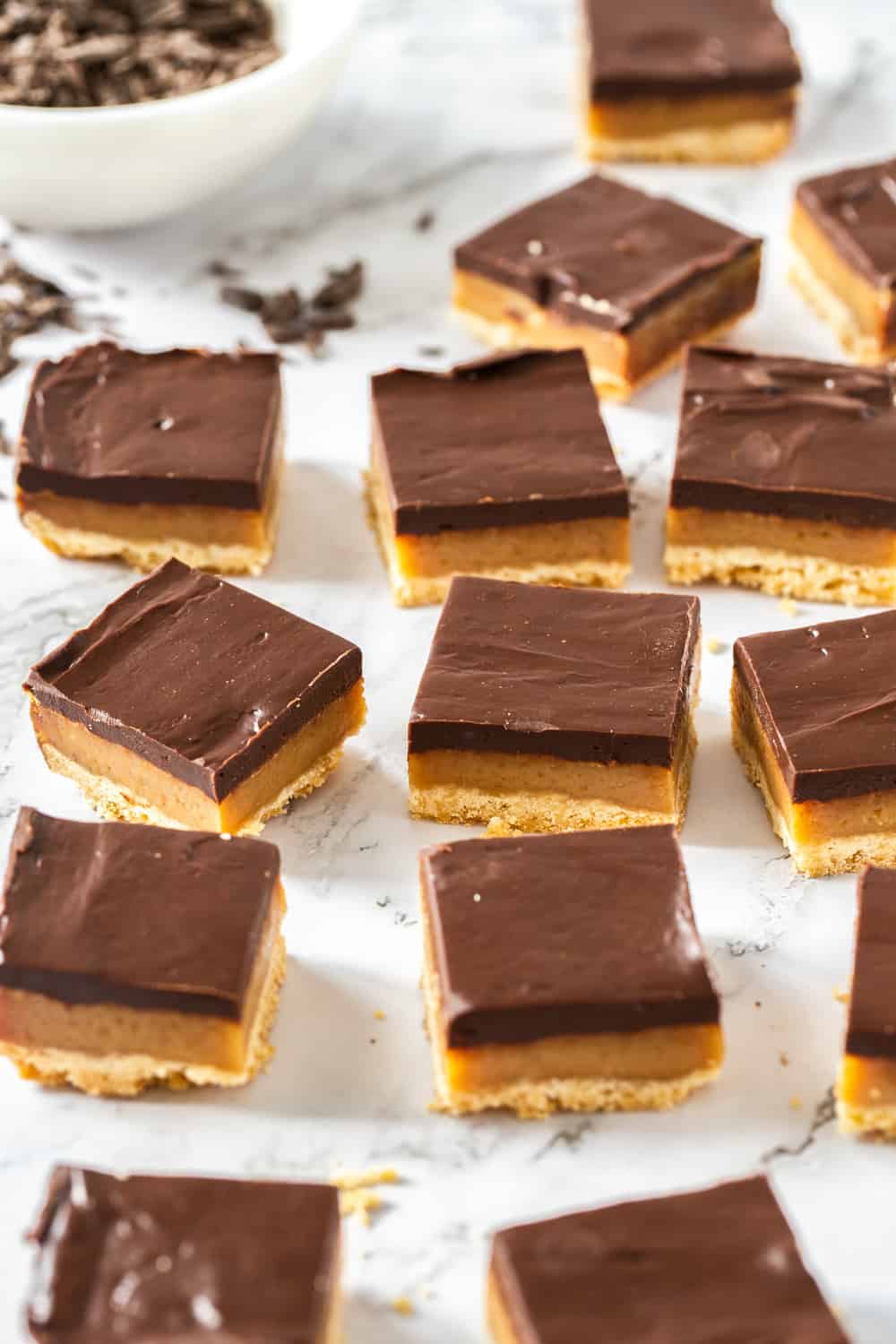 Close up of a batch of sliced up millionaire shortbread