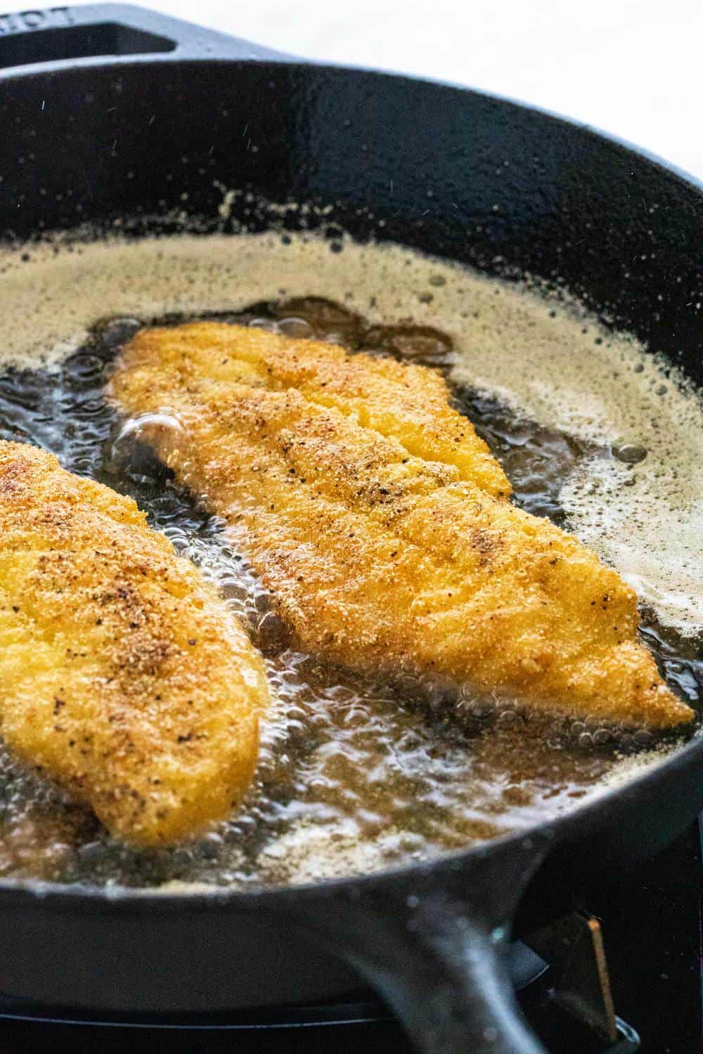 frying fish in a cast iron skillet