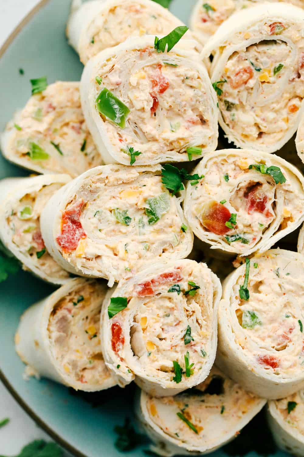 Pinwheels stacked on top of each other on a plate. 