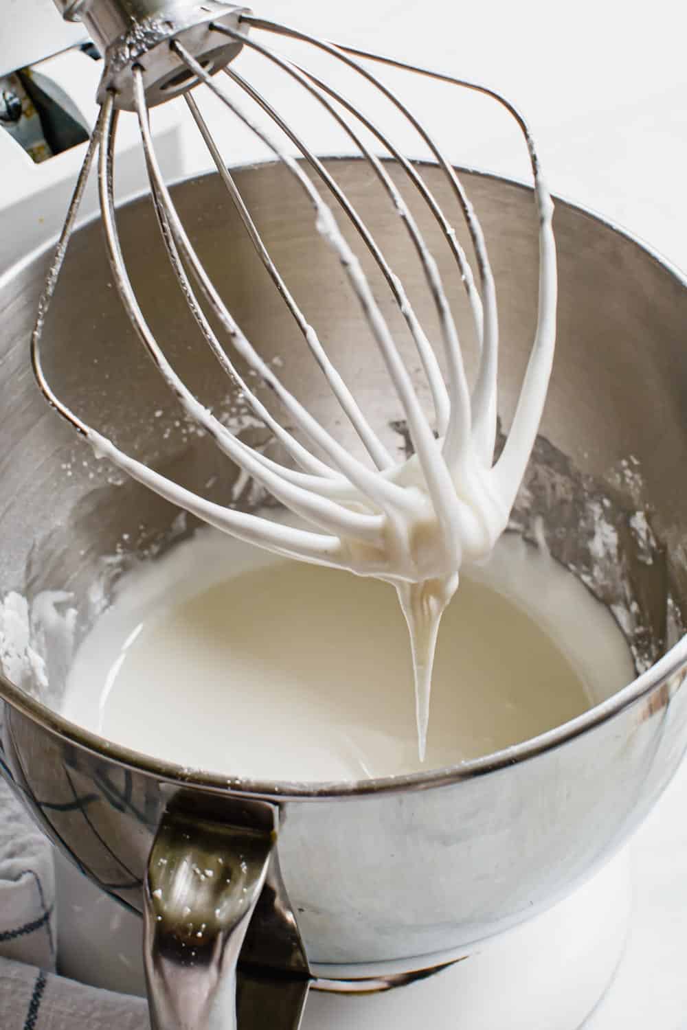 Royal icing in an electric mixing bowl.