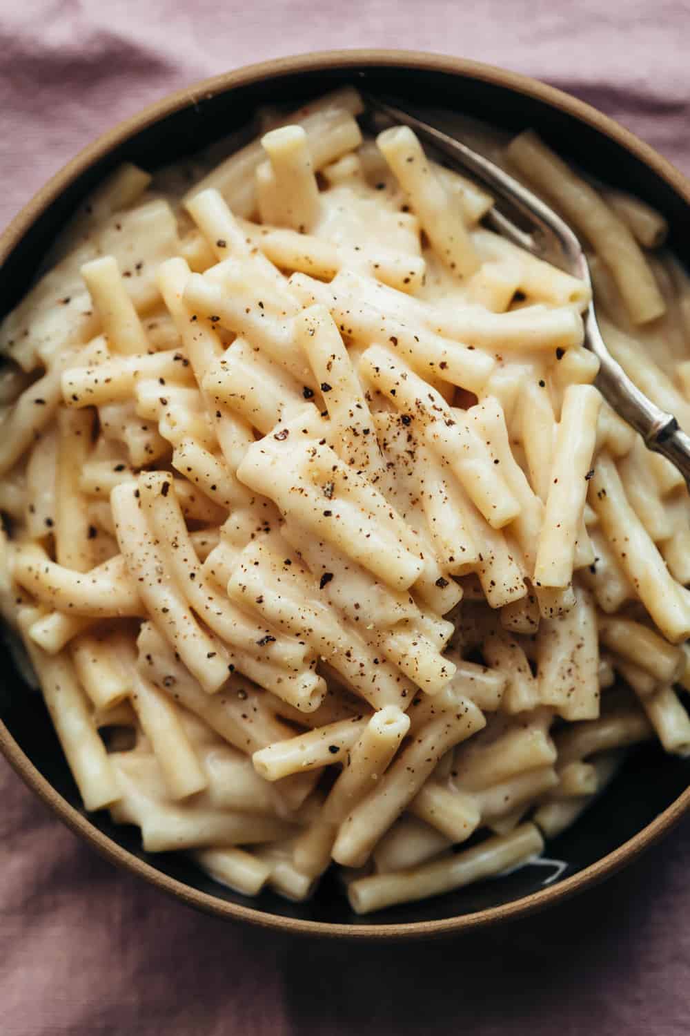 Instant pot mac and cheese served in a bowl with a fork