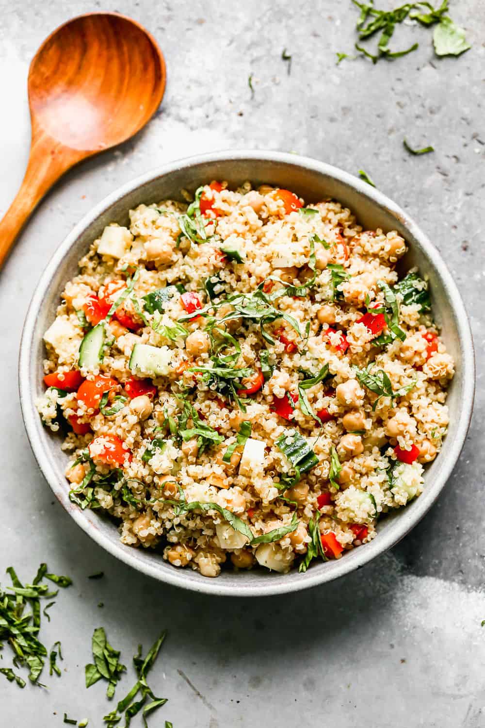 Packed with fuffy quinoa, crisp veggies, chickpeas, salty provolone cheese, and a zesty lemon vinaigrette, this easy Quinoa Salad is the perfect lunch on its own, or base for chicken, salmon or steak for dinner. 30 minutes and done!