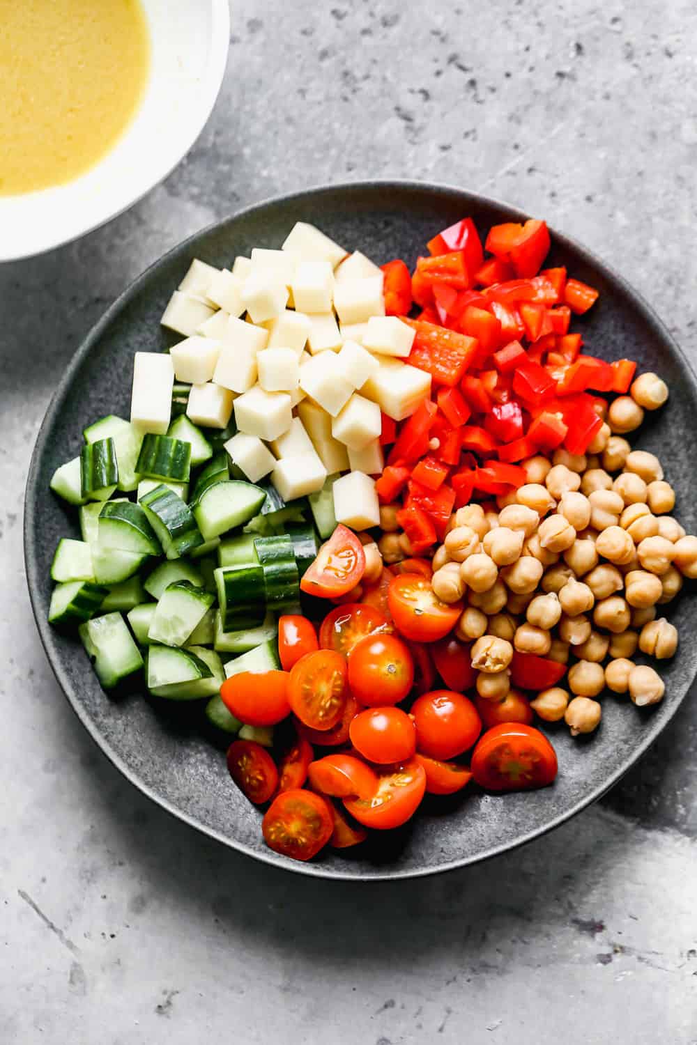 Packed with fuffy quinoa, crisp veggies, chickpeas, salty provolone cheese, and a zesty lemon vinaigrette, this easy Quinoa Salad is the perfect lunch on its own, or base for chicken, salmon or steak for dinner. 30 minutes and done!