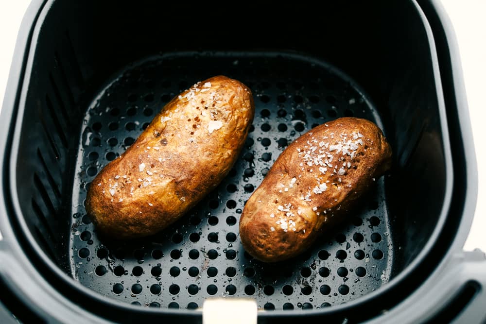 Cooked baked potatoes, golden brown and crispy. 