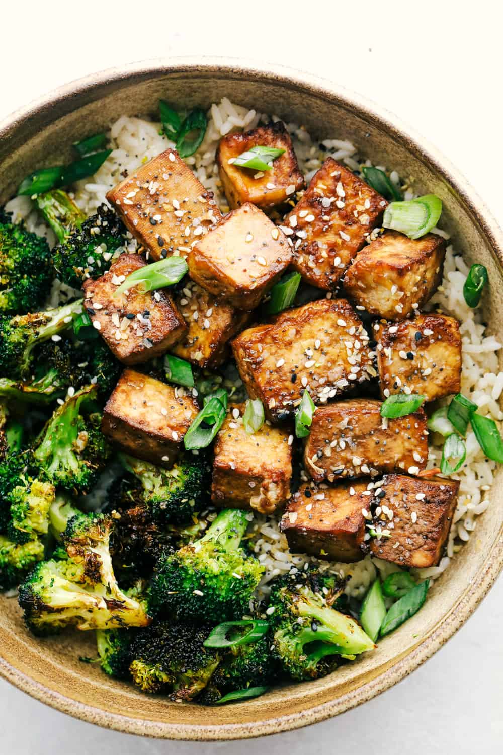 Air fryer tofu in a bowl of rice and broccoli. 