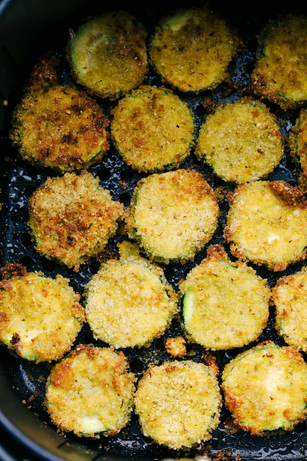 Air Fryer Zucchini chips in the air fryer. 