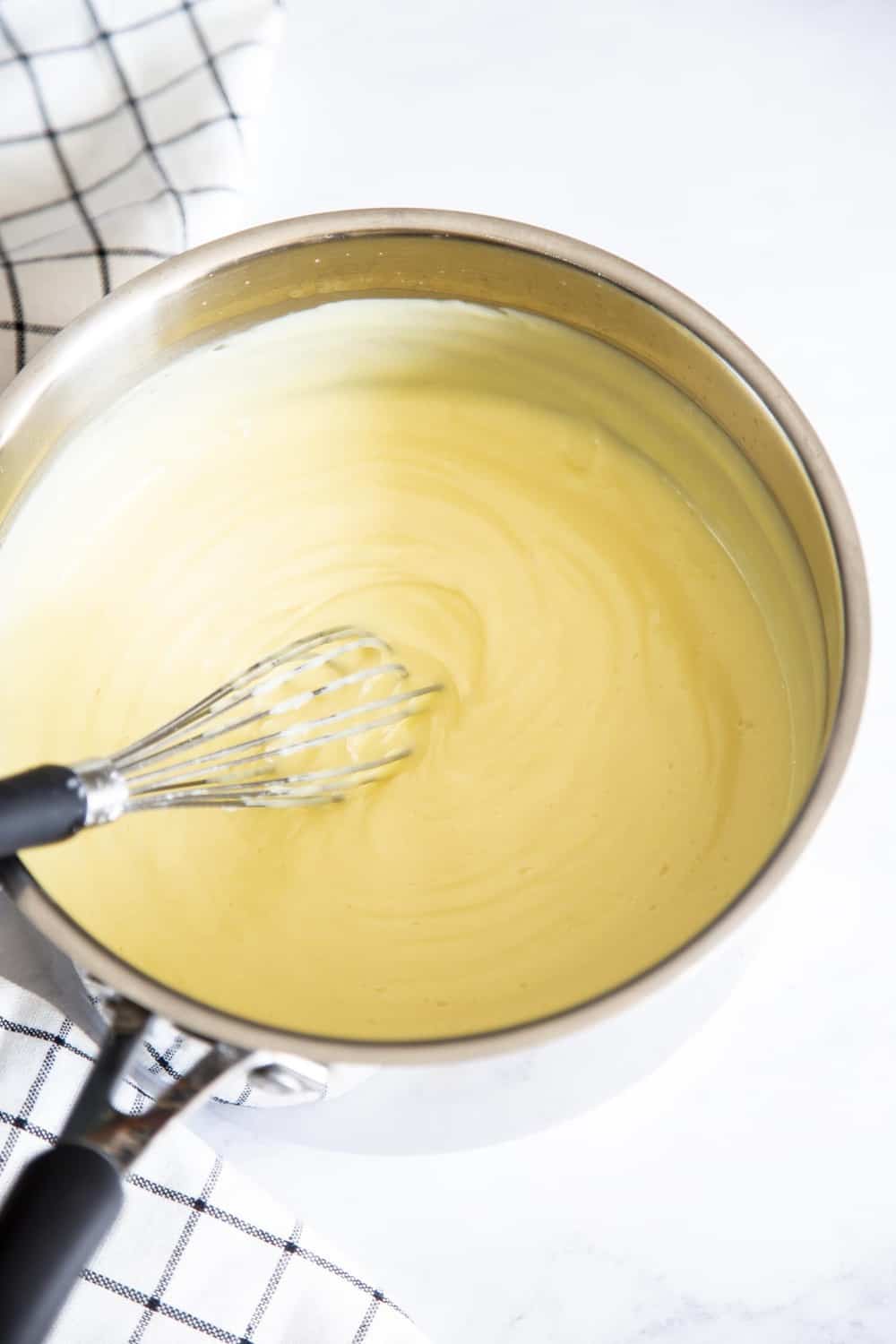 Saucepan full of cream filling for the boston cake. 