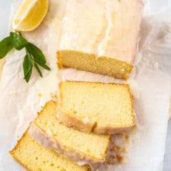 Birdseye view of a glazed cake on a sheet of baking paper.