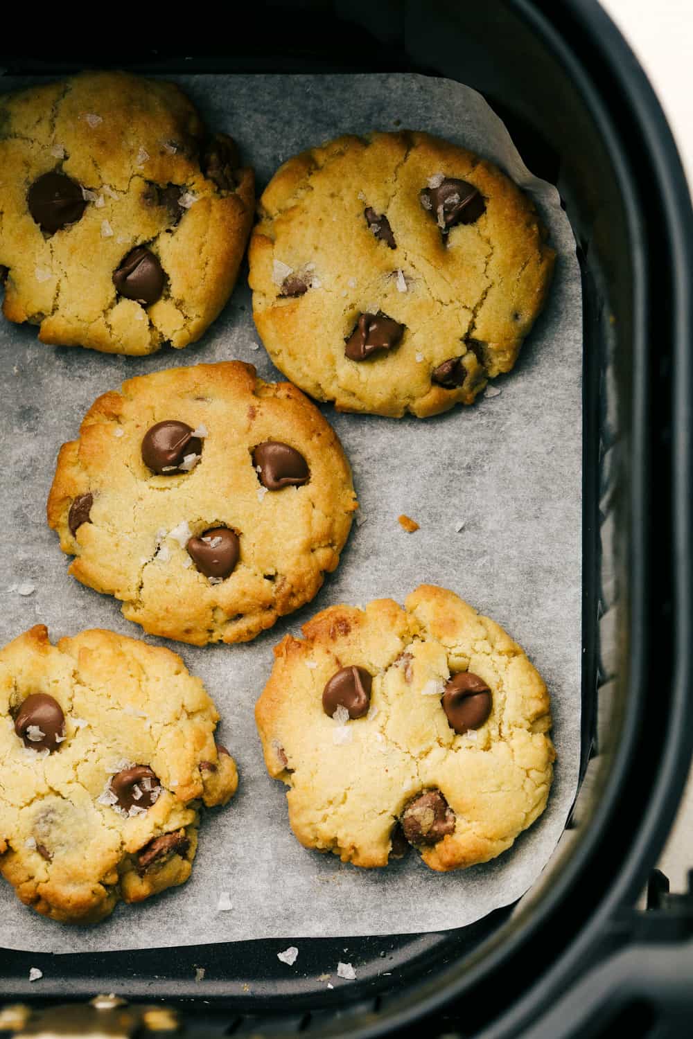 Golden brown cookies in the air fryer basket. 