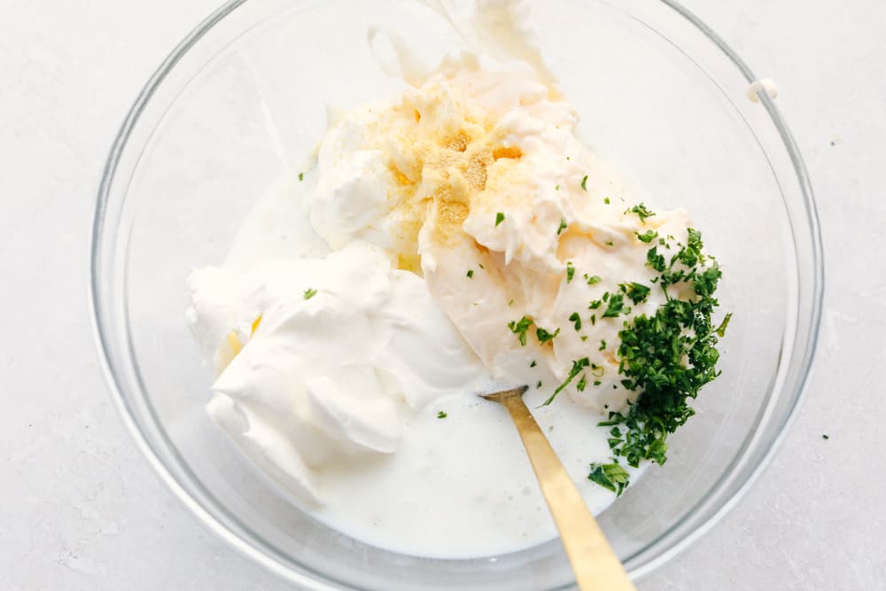 Adding the rest of the ingredients to the clear bowl. 