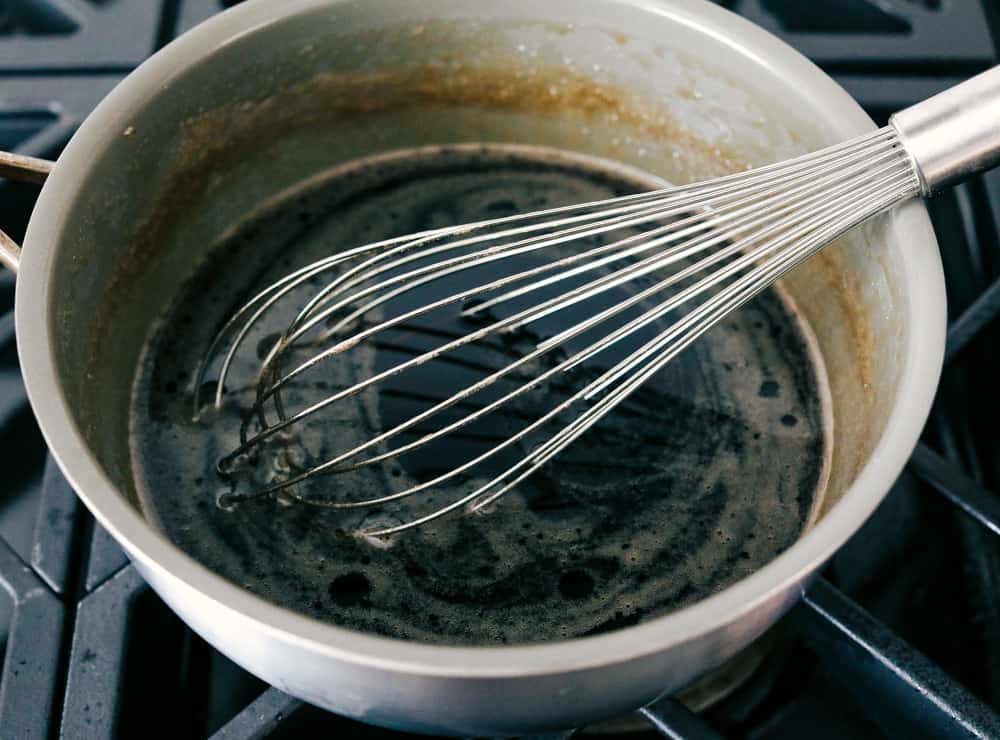 Whisking a saucepan full of maple syrup. 