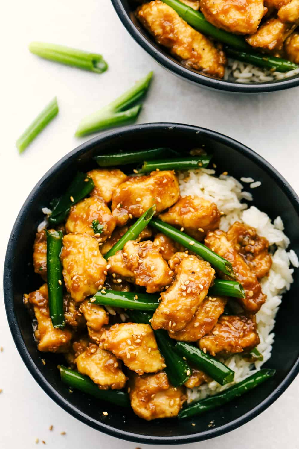 Mongolian chicken in bowl with rice. 