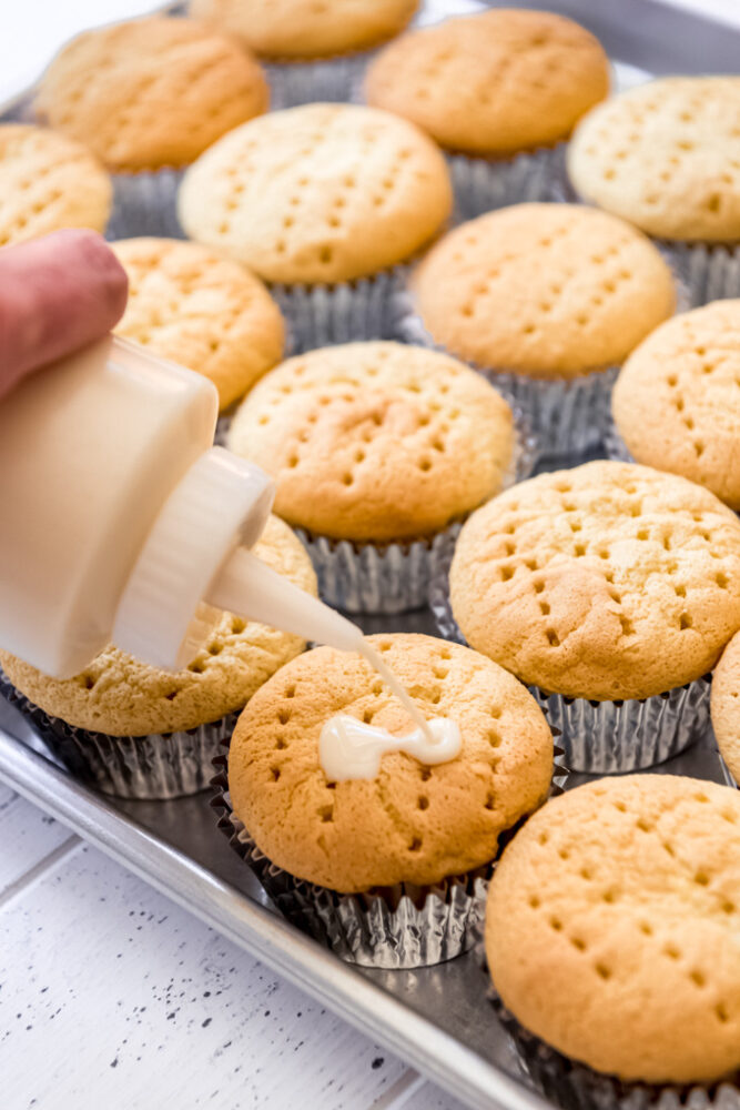 3 milk mixture soaking into cupcakes