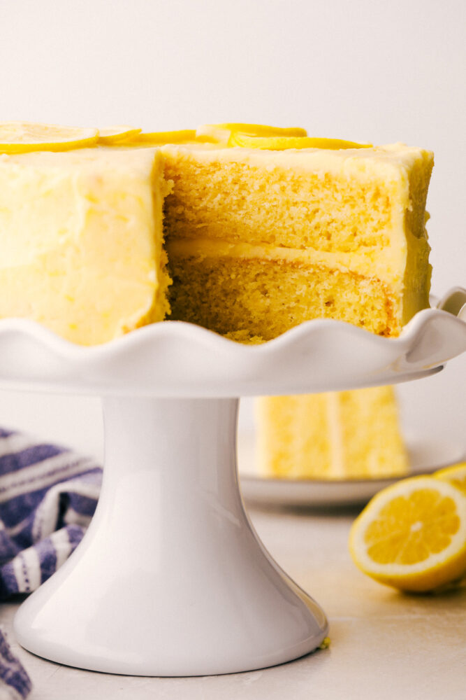 Lemon Layered Cake on a pedestal cake platter. 