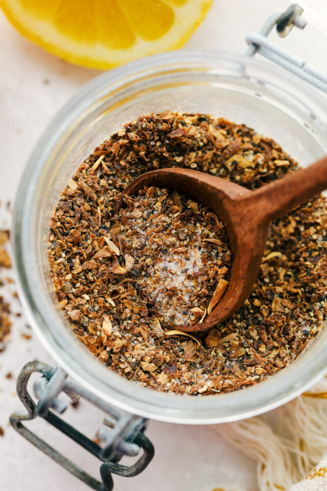 Spooning out a Tablespoon of lemon pepper. 