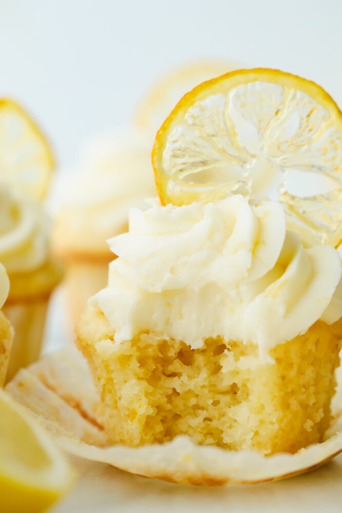 Lemon cupcake with a bite taken out of it