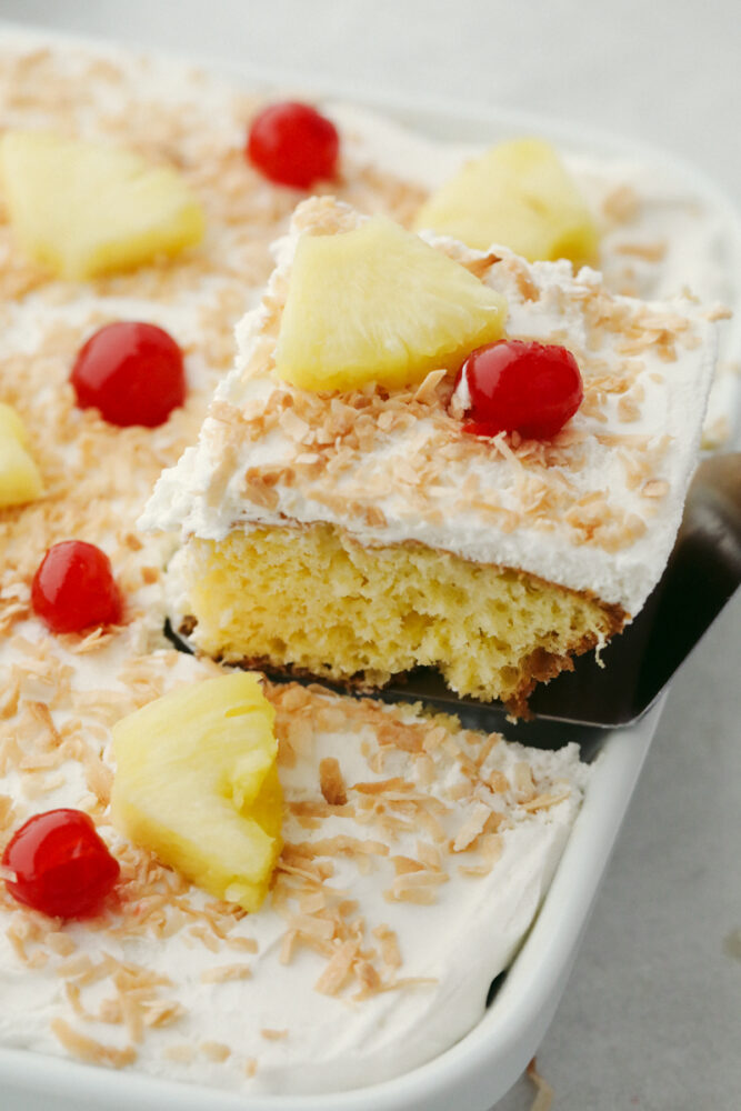 Removing a slice of cake from the pan to serve. 