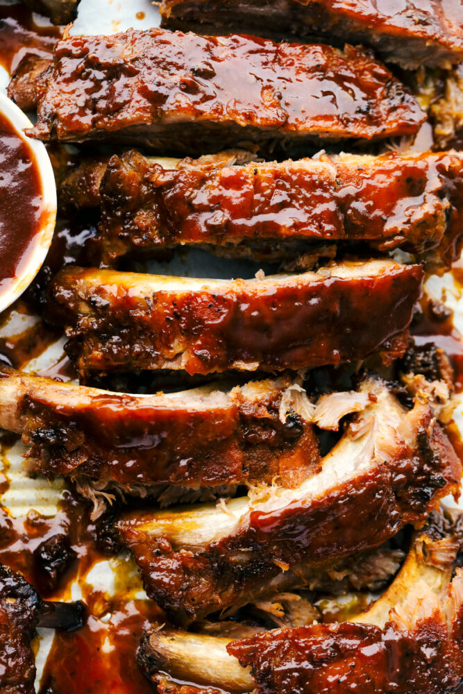 Segmented ribs with sauce showing texture. 