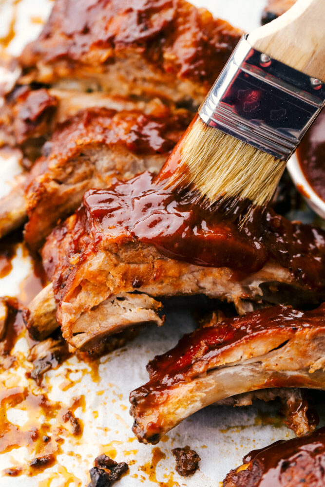 Brushing on extra sauce on the slow cooker ribs. 