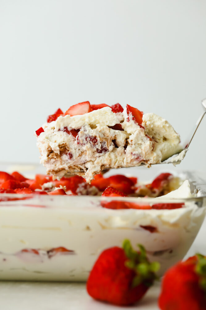 Serving a piece of Strawberry Icebox Cake.