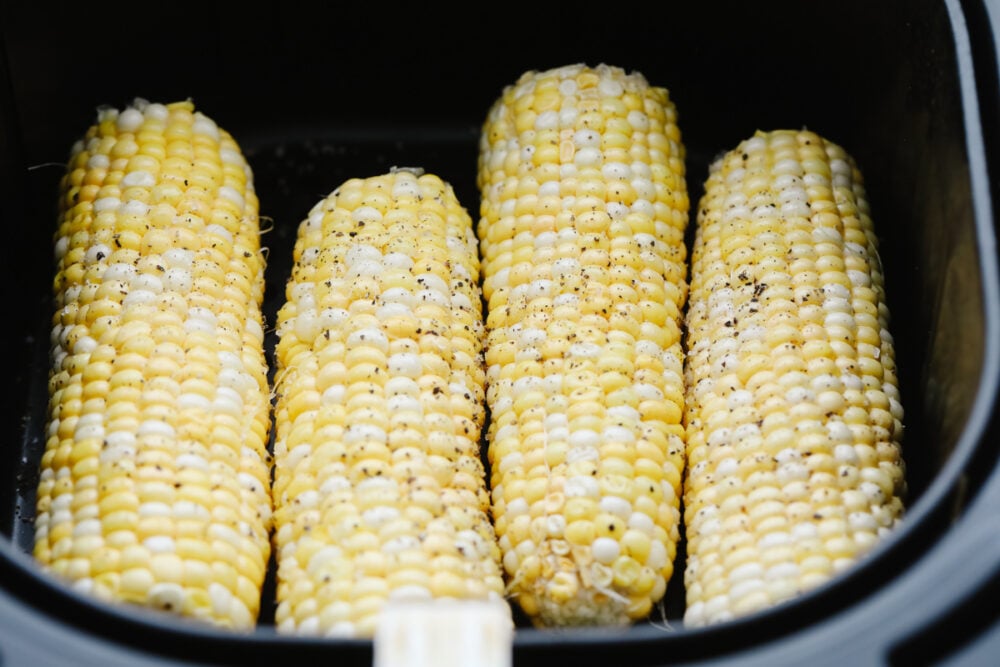 Corn on the cob in the air fryer with salt and pepper. 