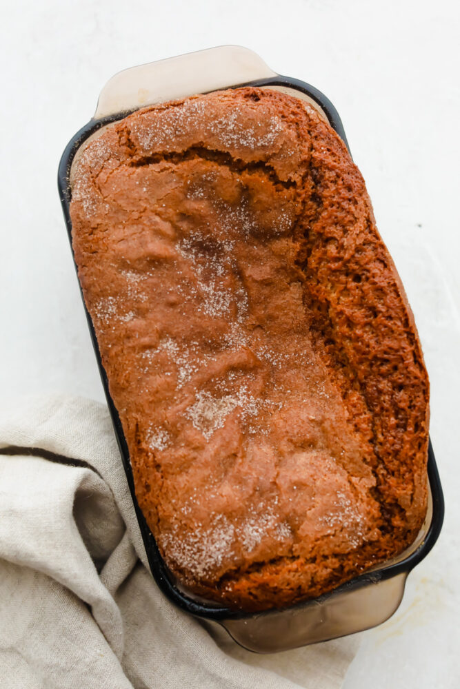 A loaf of Amish Friendship Bread, sprinkled with cinnamon sugar.