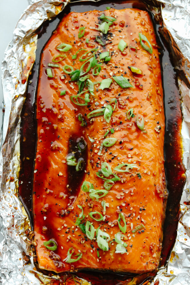 Salmon in tin foil covered in glaze.