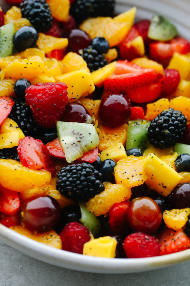 Blackberry Lime Fruit Salad with poppyseed dressing in bowl.