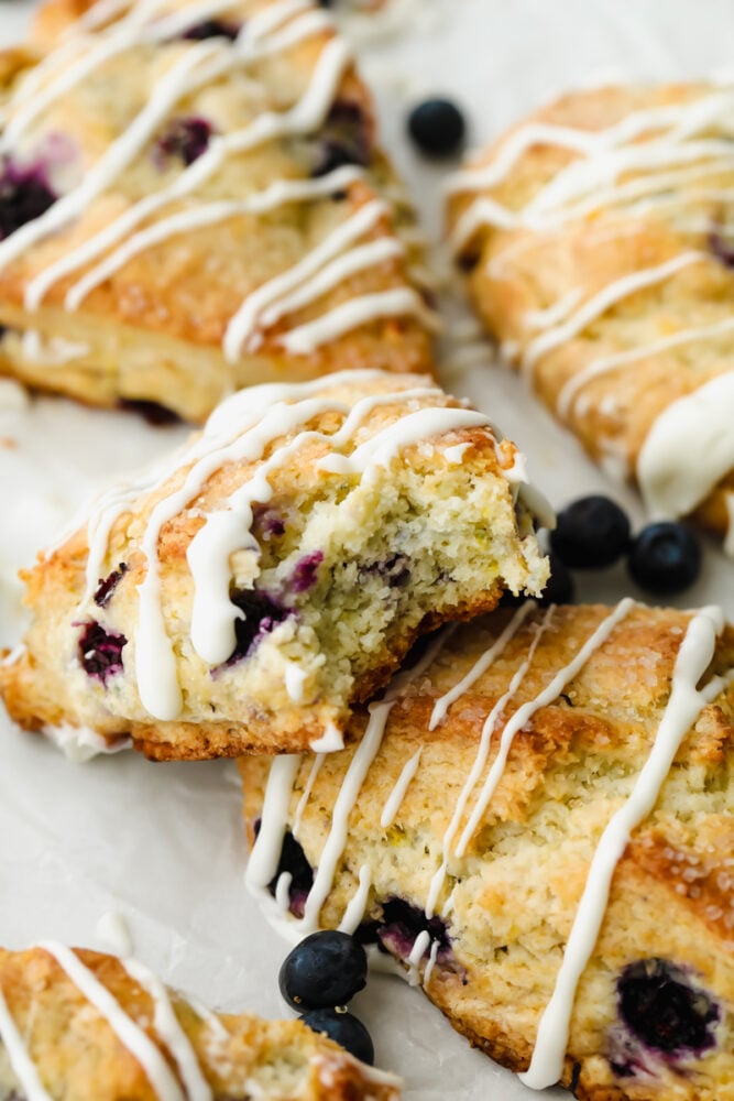 Blueberry Scone with a bite taken out of it.