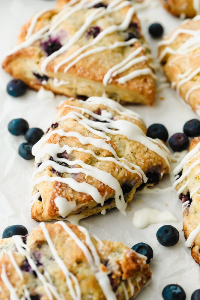 Blueberry Scones with icing drizzled on top.