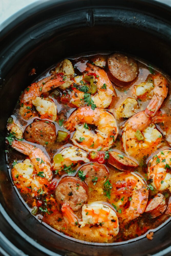 Seafood and sausage cooking in a slow cooker.