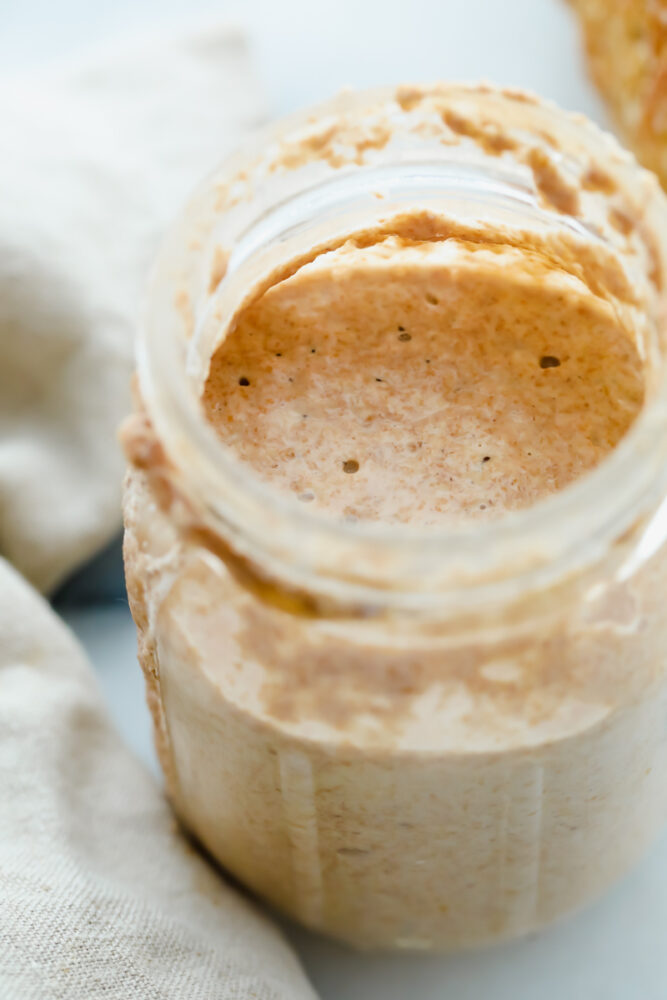 Jar filled with Sourdough Starter.