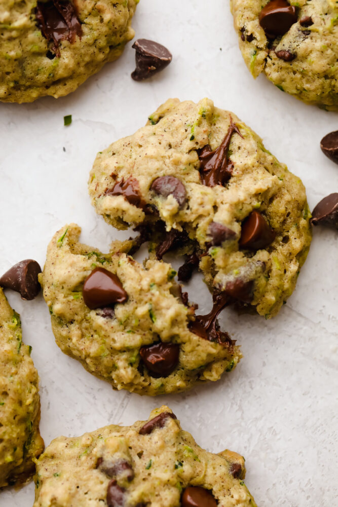 Cookie broken in half with melted chocolate chips. 