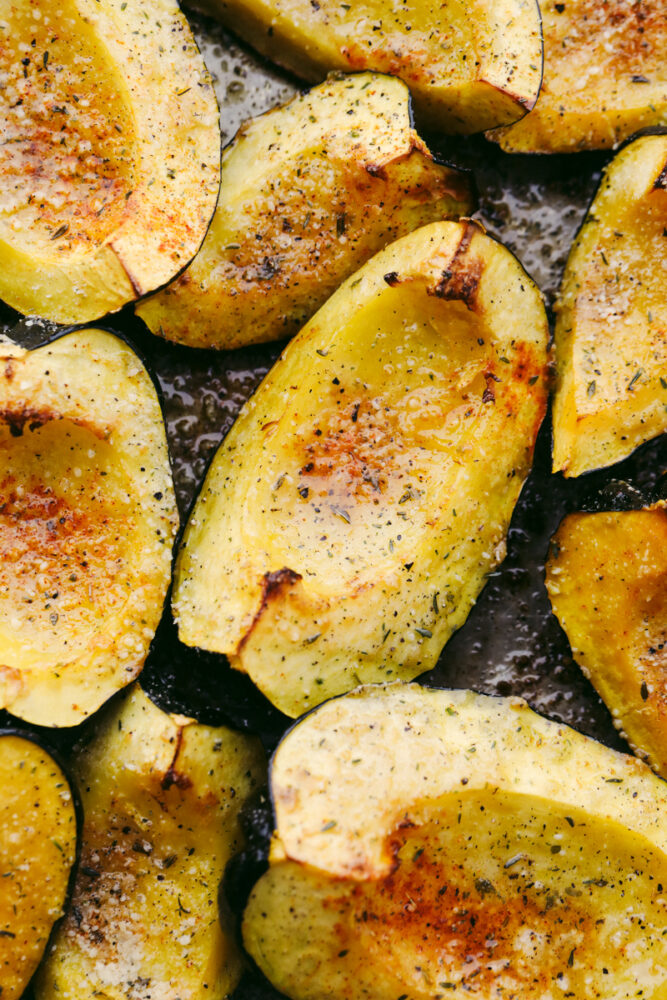 Roasted parmesan acorn squash on a pan. 