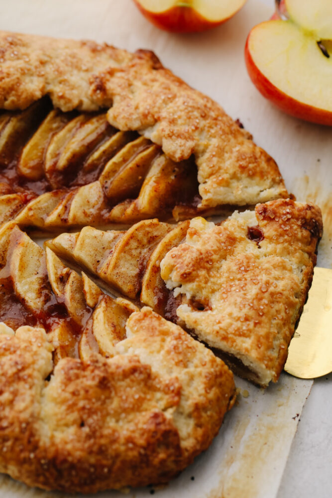 Taking a slice of apple galette.