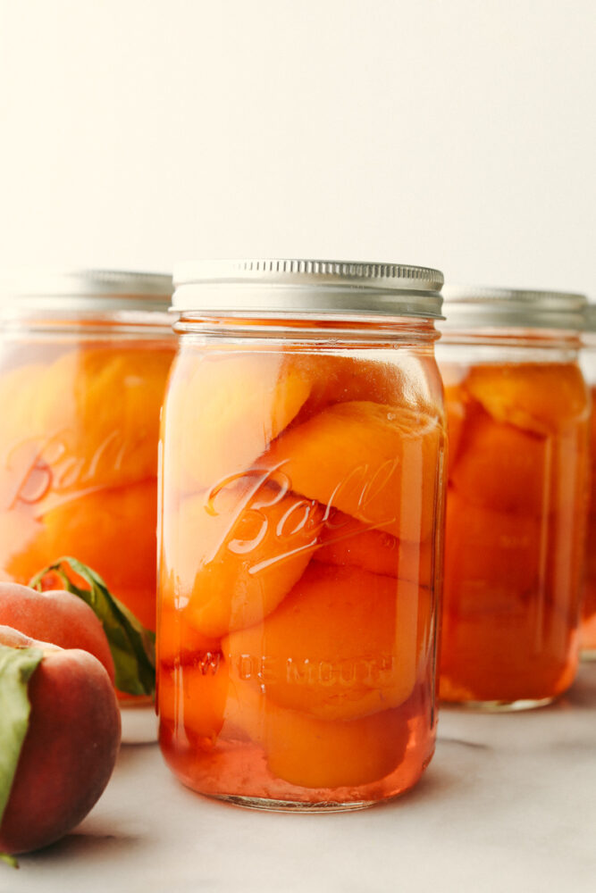 3 jars of canned peaches.