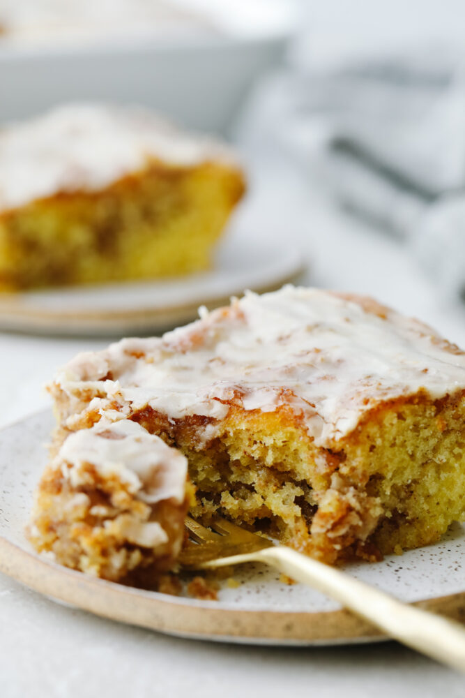 Honeybun cake being cut with a fork. 